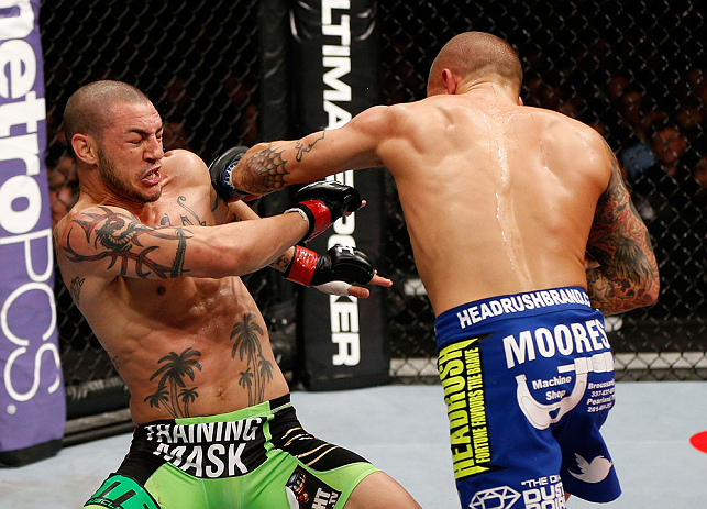 LONDON, ENGLAND - FEBRUARY 16: (R-L) Dustin Poirier punches Cub Swanson in their featherweight fight during the UFC on Fuel TV event on February 16, 2013 at Wembley Arena in London, England. (Photo by Josh Hedges/Zuffa LLC/Zuffa LLC via Getty Images)