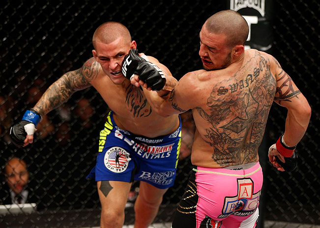 LONDON, ENGLAND - FEBRUARY 16: (L-R) Dustin Poirier punches Cub Swanson in their featherweight fight during the UFC on Fuel TV event on February 16, 2013 at Wembley Arena in London, England. (Photo by Josh Hedges/Zuffa LLC/Zuffa LLC via Getty Images)