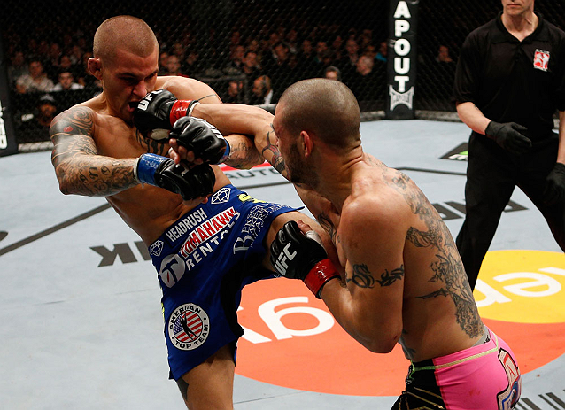 LONDON, ENGLAND - FEBRUARY 16: (R-L) Cub Swanson punches Dustin Poirier in their featherweight fight during the UFC on Fuel TV event on February 16, 2013 at Wembley Arena in London, England. (Photo by Josh Hedges/Zuffa LLC/Zuffa LLC via Getty Images)