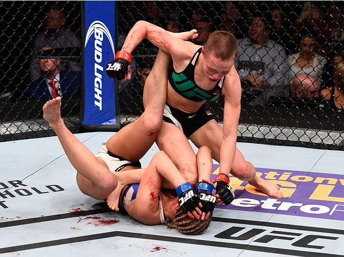 LAS VEGAS, NEVADA - DECEMBER 10: (Top) Rose Namajunas punches Paige VanZant in their women's strawweight bout during the UFC Fight Night event at The Chelsea at the Cosmopolitan of Las Vegas on December 10, 2015 in Las Vegas, Nevada. (Photo by Jeff Bott