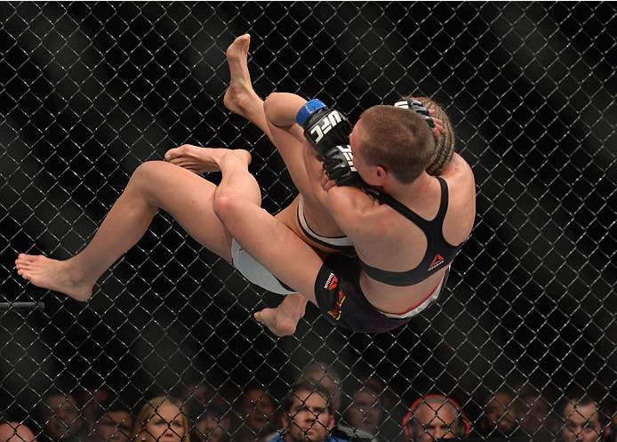 LAS VEGAS, NEVADA - DECEMBER 10: Rose Namajunas takes down and attempts a submission on Paige VanZant in their women's strawweight bout during the UFC Fight Night event at The Chelsea at the Cosmopolitan of Las Vegas on December 10, 2015 in Las Vegas, Ne