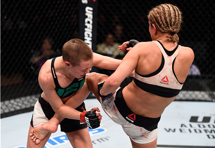 LAS VEGAS, NEVADA - DECEMBER 10: (R-L) Paige VanZant kicks Rose Namajunas in their women's strawweight bout during the UFC Fight Night event at The Chelsea at the Cosmopolitan of Las Vegas on December 10, 2015 in Las Vegas, Nevada. (Photo by Jeff Bottar
