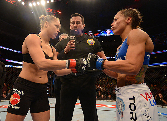 ANAHEIM, CA - FEBRUARY 23: Ronda Rousey (left) and Liz Carmouche (right) touch gloves in their women's bantamweight title fight during UFC 157 at Honda Center on February 23, 2013 in Anaheim, California. (Photo by Donald Miralle/Zuffa LLC/Zuffa LLC via