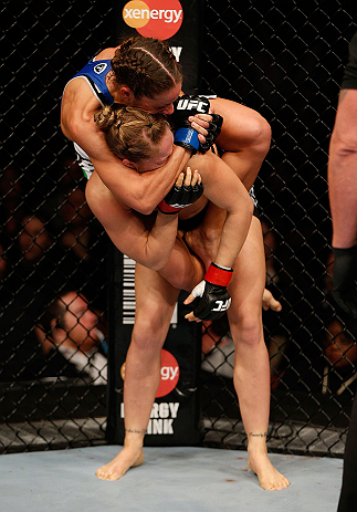 ANAHEIM, CA - FEBRUARY 23: Liz Carmouche (top) attempts to submit Ronda Rousey in their women's bantamweight title fight during UFC 157 at Honda Center on February 23, 2013 in Anaheim, California. (Photo by Josh Hedges/Zuffa LLC/Zuffa LLC via Getty Imag