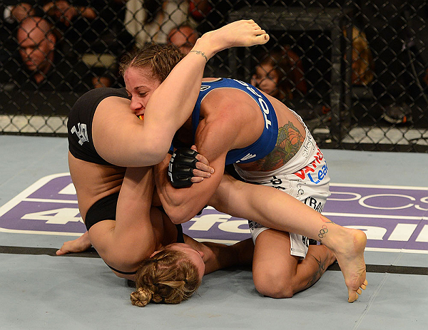 ANAHEIM, CA - FEBRUARY 23: Ronda Rousey (left) attempts to submit Liz Carmouche in their women's bantamweight title fight during UFC 157 at Honda Center on February 23, 2013 in Anaheim, California. (Photo by Donald Miralle/Zuffa LLC/Zuffa LLC via Getty
