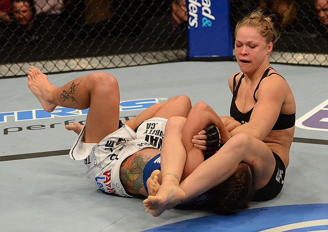 ANAHEIM, CA - FEBRUARY 23: Ronda Rousey (right) attempts to submit Liz Carmouche in their women's bantamweight title fight during UFC 157 at Honda Center on February 23, 2013 in Anaheim, California. (Photo by Donald Miralle/Zuffa LLC/Zuffa LLC via Getty