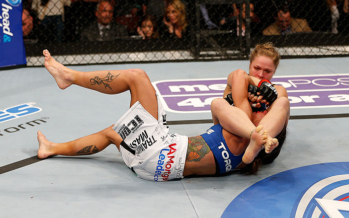 ANAHEIM, CA - FEBRUARY 23: Ronda Rousey (right) attempts to submit Liz Carmouche in their women's bantamweight title fight during UFC 157 at Honda Center on February 23, 2013 in Anaheim, California. (Photo by Josh Hedges/Zuffa LLC/Zuffa LLC via Getty Im