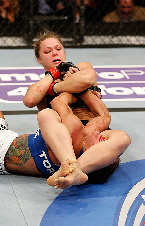 ANAHEIM, CA - FEBRUARY 23: Ronda Rousey (top) attempts to submit Liz Carmouche in their women's bantamweight title fight during UFC 157 at Honda Center on February 23, 2013 in Anaheim, California. (Photo by Josh Hedges/Zuffa LLC/Zuffa LLC via Getty Imag