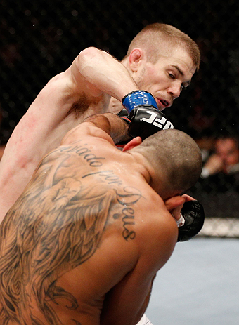 LONDON, ENGLAND - FEBRUARY 16: (L-R) Michael McDonald punches Renan Barao in their interim bantamweight title fight during the UFC on Fuel TV event on February 16, 2013 at Wembley Arena in London, England. (Photo by Josh Hedges/Zuffa LLC/Zuffa LLC via G