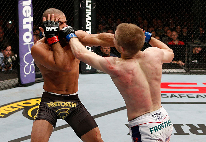 LONDON, ENGLAND - FEBRUARY 16: (R-L) Michael McDonald and Renan Barao trade punches in their interim bantamweight title fight during the UFC on Fuel TV event on February 16, 2013 at Wembley Arena in London, England. (Photo by Josh Hedges/Zuffa LLC/Zuffa