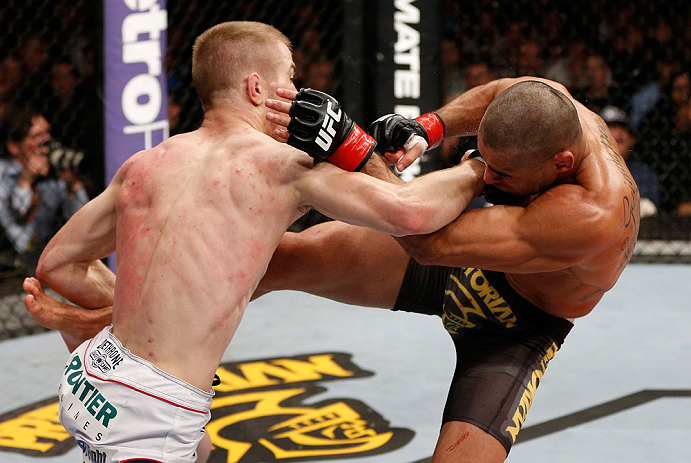 LONDON, ENGLAND - FEBRUARY 16: (L-R) Michael McDonald punches Renan Barao in their interim bantamweight title fight during the UFC on Fuel TV event on February 16, 2013 at Wembley Arena in London, England. (Photo by Josh Hedges/Zuffa LLC/Zuffa LLC via G