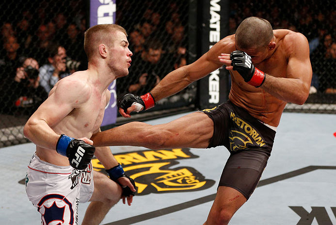 LONDON, ENGLAND - FEBRUARY 16: (R-L) Renan Barao kicks Michael McDonald in their interim bantamweight title fight during the UFC on Fuel TV event on February 16, 2013 at Wembley Arena in London, England. (Photo by Josh Hedges/Zuffa LLC/Zuffa LLC via Get