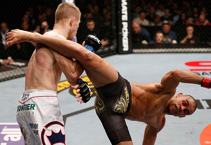 LONDON, ENGLAND - FEBRUARY 16: (R-L) Renan Barao kicks Michael McDonald in their interim bantamweight title fight during the UFC on Fuel TV event on February 16, 2013 at Wembley Arena in London, England. (Photo by Josh Hedges/Zuffa LLC/Zuffa LLC via Get