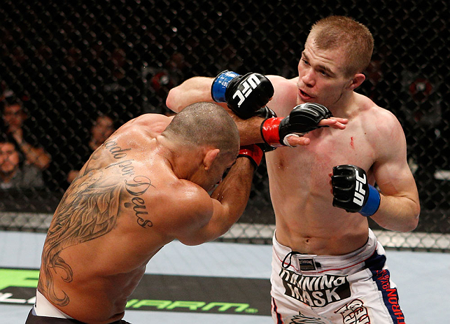 LONDON, ENGLAND - FEBRUARY 16: (R-L) Michael McDonald punches Renan Barao in their interim bantamweight title fight during the UFC on Fuel TV event on February 16, 2013 at Wembley Arena in London, England. (Photo by Josh Hedges/Zuffa LLC/Zuffa LLC via G
