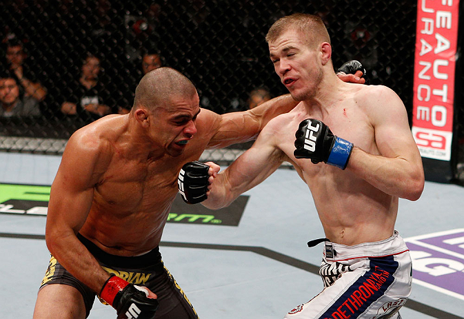LONDON, ENGLAND - FEBRUARY 16: (R-L) Michael McDonald punches Renan Barao in their interim bantamweight title fight during the UFC on Fuel TV event on February 16, 2013 at Wembley Arena in London, England. (Photo by Josh Hedges/Zuffa LLC/Zuffa LLC via G