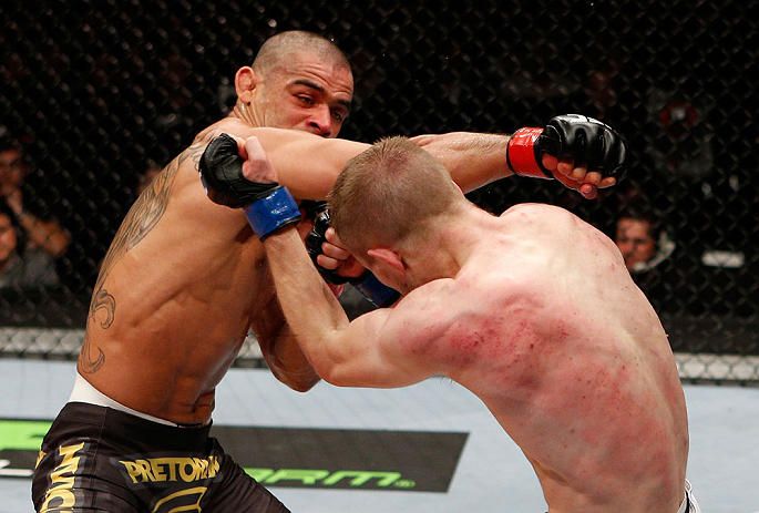 LONDON, ENGLAND - FEBRUARY 16: (L-R) Renan Barao punches Michael McDonald in their interim bantamweight title fight during the UFC on Fuel TV event on February 16, 2013 at Wembley Arena in London, England. (Photo by Josh Hedges/Zuffa LLC/Zuffa LLC via G