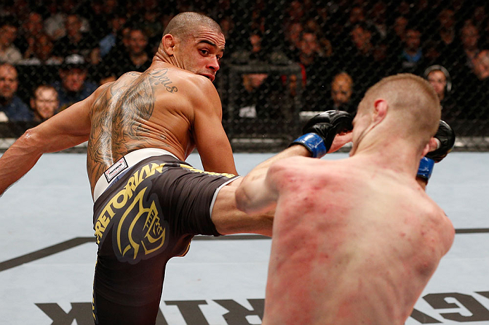 LONDON, ENGLAND - FEBRUARY 16: (L-R) Renan Barao kicks Michael McDonald in their interim bantamweight title fight during the UFC on Fuel TV event on February 16, 2013 at Wembley Arena in London, England. (Photo by Josh Hedges/Zuffa LLC/Zuffa LLC via Get