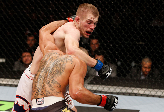 LONDON, ENGLAND - FEBRUARY 16: (L-R) Michael McDonald punches Renan Barao in their interim bantamweight title fight during the UFC on Fuel TV event on February 16, 2013 at Wembley Arena in London, England. (Photo by Josh Hedges/Zuffa LLC/Zuffa LLC via G