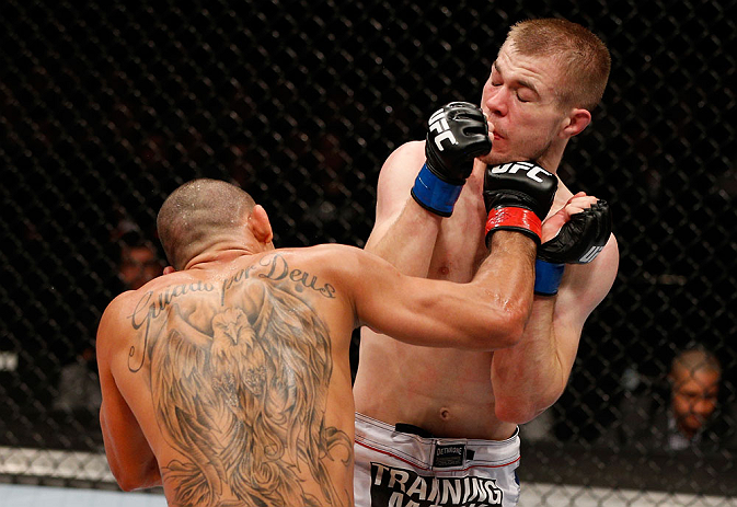 LONDON, ENGLAND - FEBRUARY 16: (L-R) Renan Barao punches Michael McDonald in their interim bantamweight title fight during the UFC on Fuel TV event on February 16, 2013 at Wembley Arena in London, England. (Photo by Josh Hedges/Zuffa LLC/Zuffa LLC via G