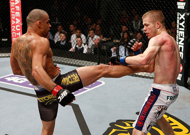 LONDON, ENGLAND - FEBRUARY 16: (L-R) Renan Barao kicks Michael McDonald in their interim bantamweight title fight during the UFC on Fuel TV event on February 16, 2013 at Wembley Arena in London, England. (Photo by Josh Hedges/Zuffa LLC/Zuffa LLC via Get
