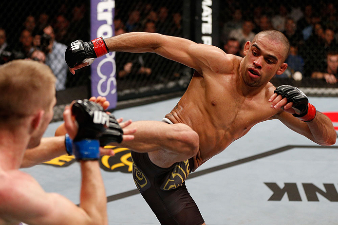 LONDON, ENGLAND - FEBRUARY 16: (R-L) Renan Barao kicks Michael McDonald in their interim bantamweight title fight during the UFC on Fuel TV event on February 16, 2013 at Wembley Arena in London, England. (Photo by Josh Hedges/Zuffa LLC/Zuffa LLC via Get