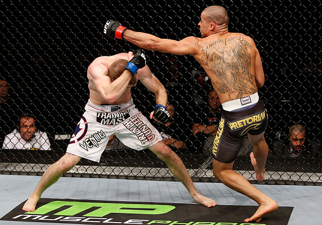 LONDON, ENGLAND - FEBRUARY 16: (R-L) Renan Barao punches Michael McDonald in their interim bantamweight title fight during the UFC on Fuel TV event on February 16, 2013 at Wembley Arena in London, England. (Photo by Josh Hedges/Zuffa LLC/Zuffa LLC via G
