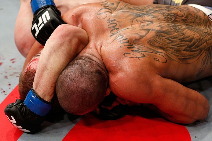 LONDON, ENGLAND - FEBRUARY 16: (R-L) Renan Barao secures an arm triangle choke submission to defeat Michael McDonald in their interim bantamweight title fight during the UFC on Fuel TV event on February 16, 2013 at Wembley Arena in London, England. (Pho