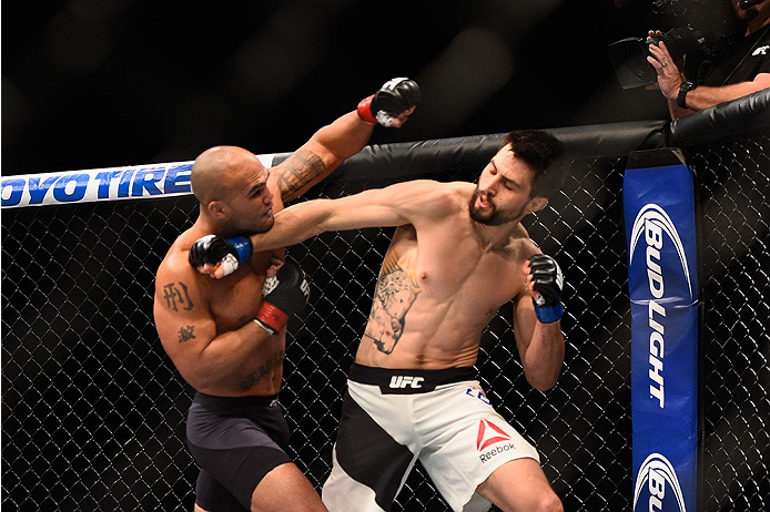 LAS VEGAS, NV - JANUARY 02: (R-L) Carlos Condit punches Robbie Lawler in their UFC welterweight championship bout during the UFC 195 event inside MGM Grand Garden Arena on January 2, 2016 in Las Vegas, Nevada. (Photo by Jeff Bottari/Zuffa LLC/Zuffa LLC v