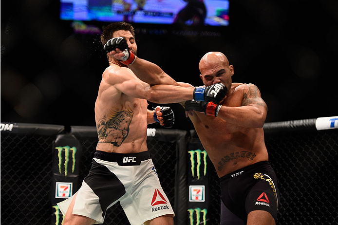 LAS VEGAS, NV - JANUARY 02: (L-R) Carlos Condit punches Robbie Lawler in their UFC welterweight championship bout during the UFC 195 event inside MGM Grand Garden Arena on January 2, 2016 in Las Vegas, Nevada. (Photo by Jeff Bottari/Zuffa LLC/Zuffa LLC v