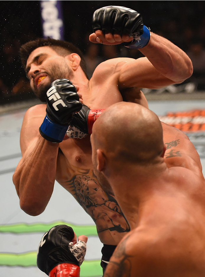 LAS VEGAS, NV - JANUARY 02: Robbie Lawler (bottom) punches Carlos Condit in their UFC welterweight championship bout during the UFC 195 event inside MGM Grand Garden Arena on January 2, 2016 in Las Vegas, Nevada. (Photo by Josh Hedges/Zuffa LLC/Zuffa LLC