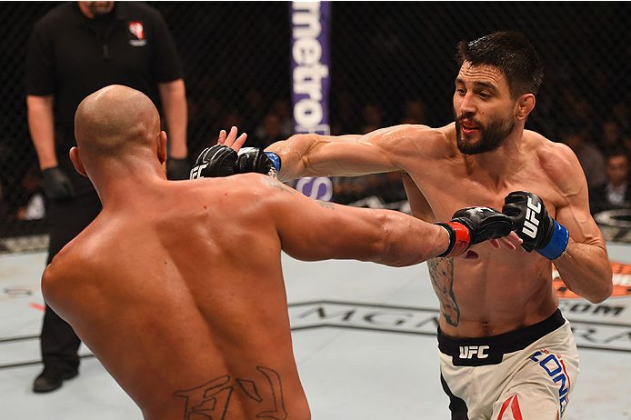 LAS VEGAS, NV - JANUARY 02: (R-L) Carlos Condit punches Robbie Lawler in their UFC welterweight championship bout during the UFC 195 event inside MGM Grand Garden Arena on January 2, 2016 in Las Vegas, Nevada. (Photo by Josh Hedges/Zuffa LLC/Zuffa LLC vi