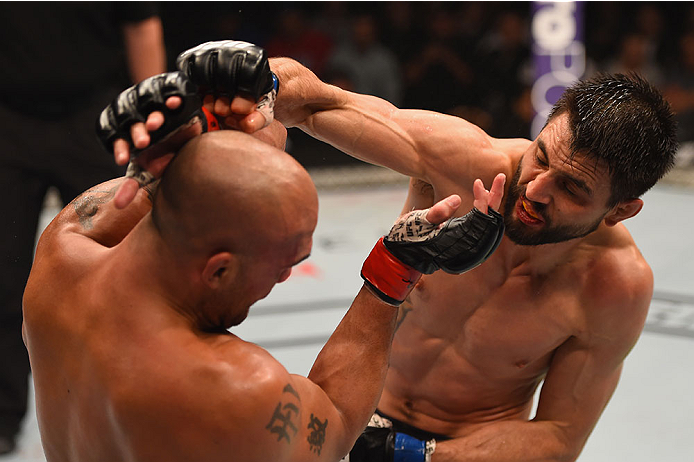 LAS VEGAS, NV - JANUARY 02: (R-L) Carlos Condit punches Robbie Lawler in their UFC welterweight championship bout during the UFC 195 event inside MGM Grand Garden Arena on January 2, 2016 in Las Vegas, Nevada. (Photo by Josh Hedges/Zuffa LLC/Zuffa LLC v