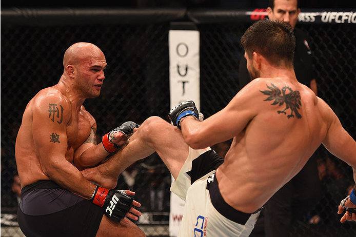 LAS VEGAS, NV - JANUARY 02: (R-L) Carlos Condit kicks Robbie Lawler in their UFC welterweight championship bout during the UFC 195 event inside MGM Grand Garden Arena on January 2, 2016 in Las Vegas, Nevada. (Photo by Josh Hedges/Zuffa LLC/Zuffa LLC via