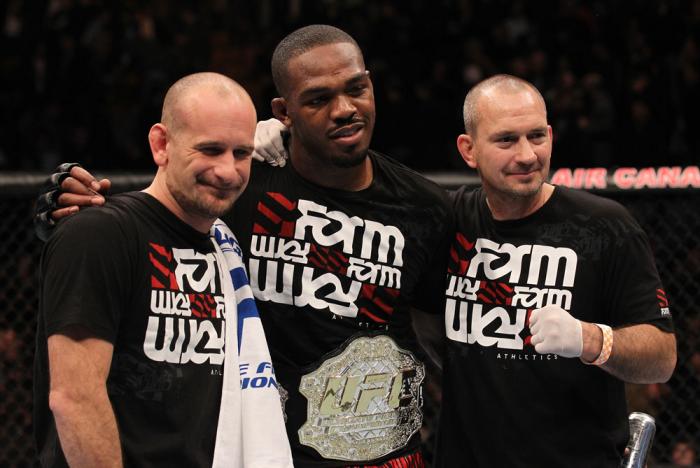TORONTO, ON - DECEMBER 10: UFC Light Heavyweight Champion Jon "Bones" Jones poses for a photo with his trainers Greg Jackson (L) and Mike Winklejohn (R) after defeating Lyoto Machida during the UFC 140 event at Air Canada Centre on December 10, 2011 in T