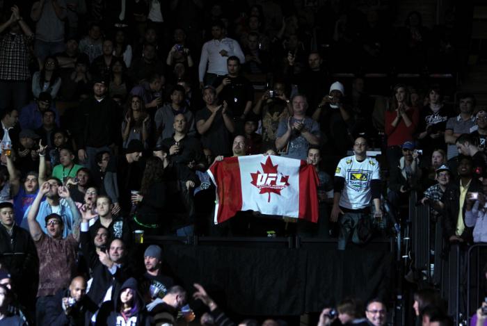 TORONTO, ON - DECEMBER 10: A fan waves a UFC Canadian flag during the UFC 140 event at Air Canada Centre on December 10, 2011 in Toronto, Ontario, Canada. (Photo by Josh Hedges/Zuffa LLC/Zuffa LLC via Getty Images)