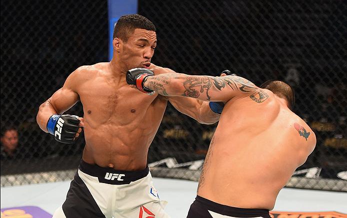 LAS VEGAS, NV - APRIL 23: (L-R) Kevin Lee punches Efrain Escudero of Mexico in their lightweight bout during the UFC 197 event inside MGM Grand Garden Arena on April 23, 2016 in Las Vegas, Nevada. (Photo by Josh Hedges/Zuffa LLC/Zuffa LLC via Getty Imag