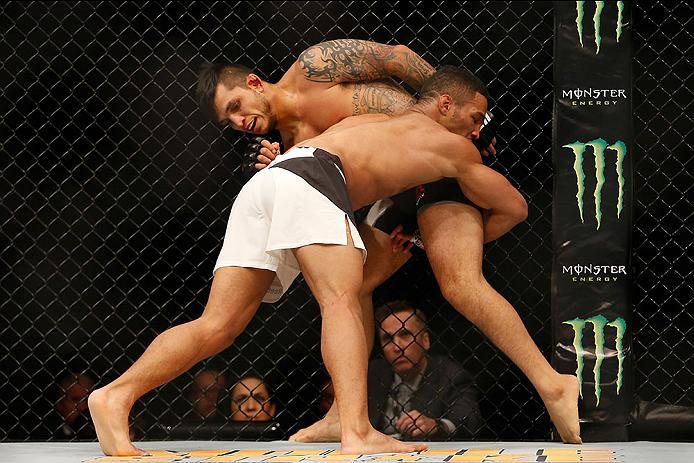 LAS VEGAS, NV - APRIL 23: Kevin Lee (L-R) attempts to take down Efrain Escudero of Mexico in their lightweight bout during the UFC 197 event inside MGM Grand Garden Arena on April 23, 2016 in Las Vegas, Nevada. (Photo by Christian Petersen/Zuffa LLC/Zuf
