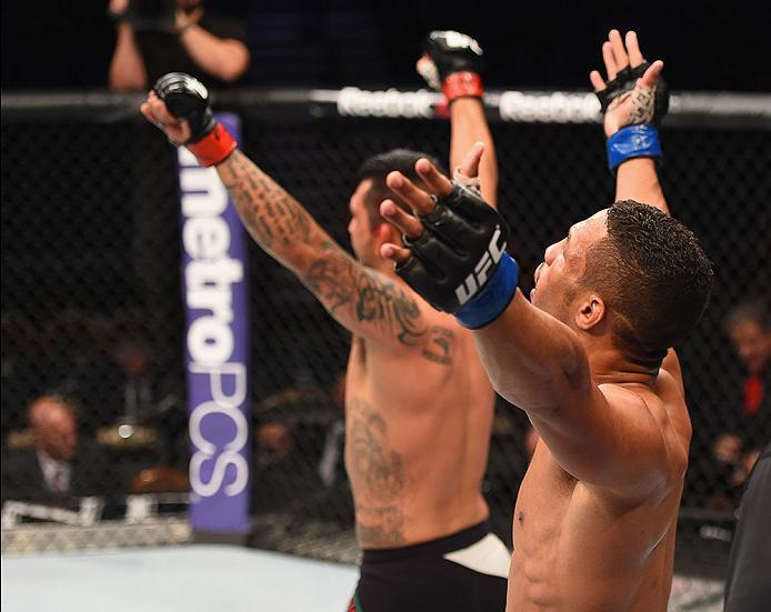 LAS VEGAS, NV - APRIL 23: (R-L) Efrain Escudero of Mexico and Kevin Lee celebrate after their lightweight bout during the UFC 197 event inside MGM Grand Garden Arena on April 23, 2016 in Las Vegas, Nevada. (Photo by Josh Hedges/Zuffa LLC/Zuffa LLC via G