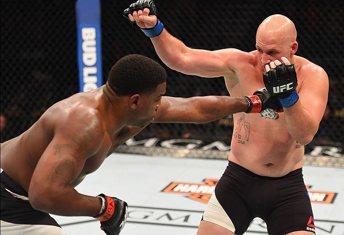 LAS VEGAS, NV - APRIL 23: (L-R) Walt Harris punches Cody East in their heavyweight bout during the UFC 197 event inside MGM Grand Garden Arena on April 23, 2016 in Las Vegas, Nevada. (Photo by Josh Hedges/Zuffa LLC/Zuffa LLC via Getty Images)