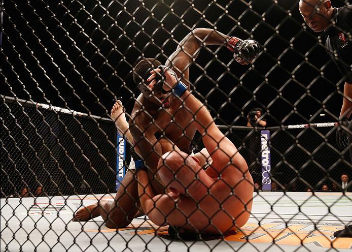 LAS VEGAS, NV - APRIL 23: Walt Harris (top) punches Cody East in their heavyweight bout during the UFC 197 event inside MGM Grand Garden Arena on April 23, 2016 in Las Vegas, Nevada. (Photo by Christian Petersen/Zuffa LLC/Zuffa LLC via Getty Images)