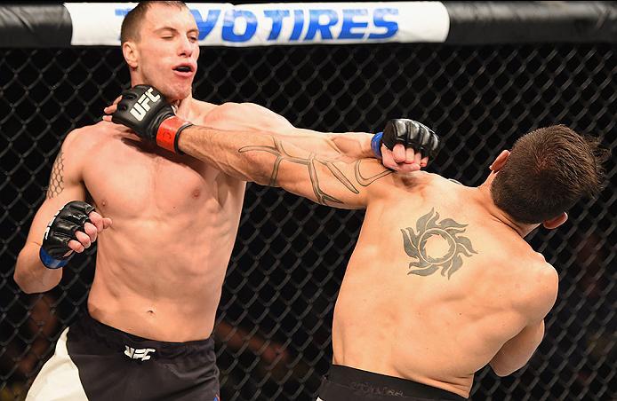 LAS VEGAS, NV - APRIL 23: (L-R) James Vick exchange punches with Glaico Franca of Brazil in their lightweight bout during the UFC 197 event inside MGM Grand Garden Arena on April 23, 2016 in Las Vegas, Nevada. (Photo by Josh Hedges/Zuffa LLC/Zuffa LLC v