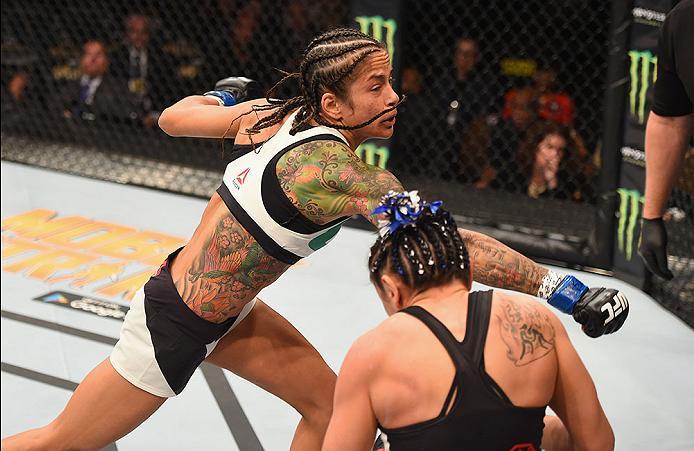 LAS VEGAS, NV - APRIL 23: (L-R) Juliana Lima punches Carla Esparza in their women's strawweight bout during the UFC 197 event inside MGM Grand Garden Arena on April 23, 2016 in Las Vegas, Nevada. (Photo by Josh Hedges/Zuffa LLC/Zuffa LLC via Getty Image