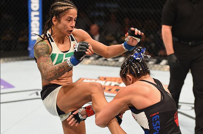 LAS VEGAS, NV - APRIL 23: (L-R) Juliana Lima knees Carla Esparza in their women's strawweight bout during the UFC 197 event inside MGM Grand Garden Arena on April 23, 2016 in Las Vegas, Nevada. (Photo by Josh Hedges/Zuffa LLC/Zuffa LLC via Getty Images)