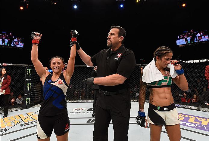 LAS VEGAS, NV - APRIL 23: (L-R) Carla Esparza celebrates her victory over Juliana Lima in their women's strawweight bout during the UFC 197 event inside MGM Grand Garden Arena on April 23, 2016 in Las Vegas, Nevada. (Photo by Josh Hedges/Zuffa LLC/Zuffa
