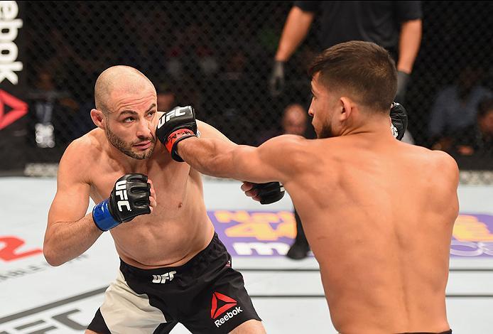 LAS VEGAS, NV - APRIL 23: (R-L) Sergio Pettis punches Chris Kelades in their flyweight bout during the UFC 197 event inside MGM Grand Garden Arena on April 23, 2016 in Las Vegas, Nevada. (Photo by Josh Hedges/Zuffa LLC/Zuffa LLC via Getty Images)