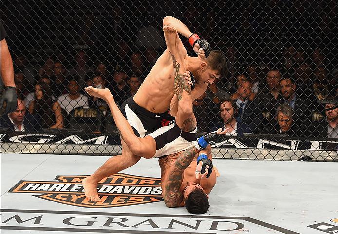 LAS VEGAS, NV - APRIL 23: Yair Rodriguez (Top) punches Andre Fili in their featherweight bout during the UFC 197 event inside MGM Grand Garden Arena on April 23, 2016 in Las Vegas, Nevada. (Photo by Josh Hedges/Zuffa LLC/Zuffa LLC via Getty Images)