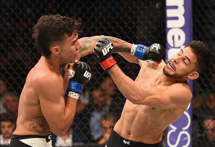 LAS VEGAS, NV - APRIL 23: (L-R) Andre Fili punches Yair Rodriguez of Mexico in their featherweight bout during the UFC 197 event inside MGM Grand Garden Arena on April 23, 2016 in Las Vegas, Nevada. (Photo by Josh Hedges/Zuffa LLC/Zuffa LLC via Getty Im