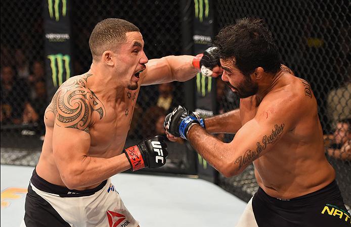 LAS VEGAS, NV - APRIL 23: (L-R) Robert Whittaker of New Zealand punches Rafael Natal in their middleweight bout during the UFC 197 event inside MGM Grand Garden Arena on April 23, 2016 in Las Vegas, Nevada. (Photo by Josh Hedges/Zuffa LLC/Zuffa LLC via