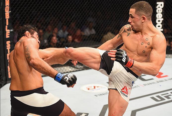 LAS VEGAS, NV - APRIL 23: (R-L) Robert Whittaker of New Zealand kicks Rafael Natal in their middleweight bout during the UFC 197 event inside MGM Grand Garden Arena on April 23, 2016 in Las Vegas, Nevada. (Photo by Josh Hedges/Zuffa LLC/Zuffa LLC via Ge