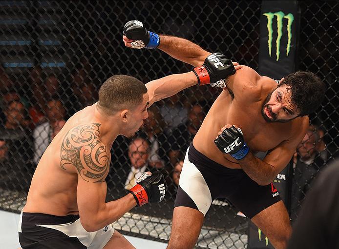 LAS VEGAS, NV - APRIL 23: (L-R) Robert Whittaker of New Zealand exchange strikes with Rafael Natal in their middleweight bout during the UFC 197 event inside MGM Grand Garden Arena on April 23, 2016 in Las Vegas, Nevada. (Photo by Josh Hedges/Zuffa LLC/